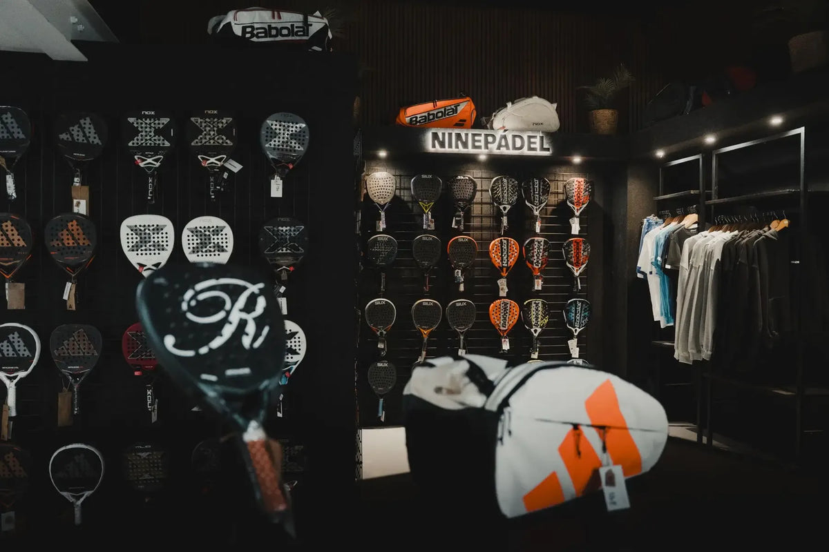 Inside the NINEPADEL shop: the racket wall and kit rails